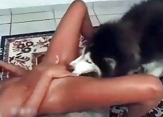 This Latina has tan lines on and she is joined by a doggo