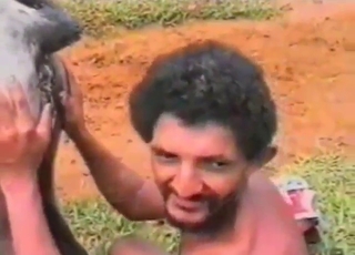 Curly-haired Latino zoophile about to fuck beast