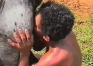 Curly-haired Latino zoophile about to fuck beast