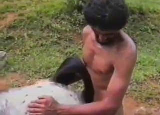 Curly-haired Latino zoophile about to fuck beast